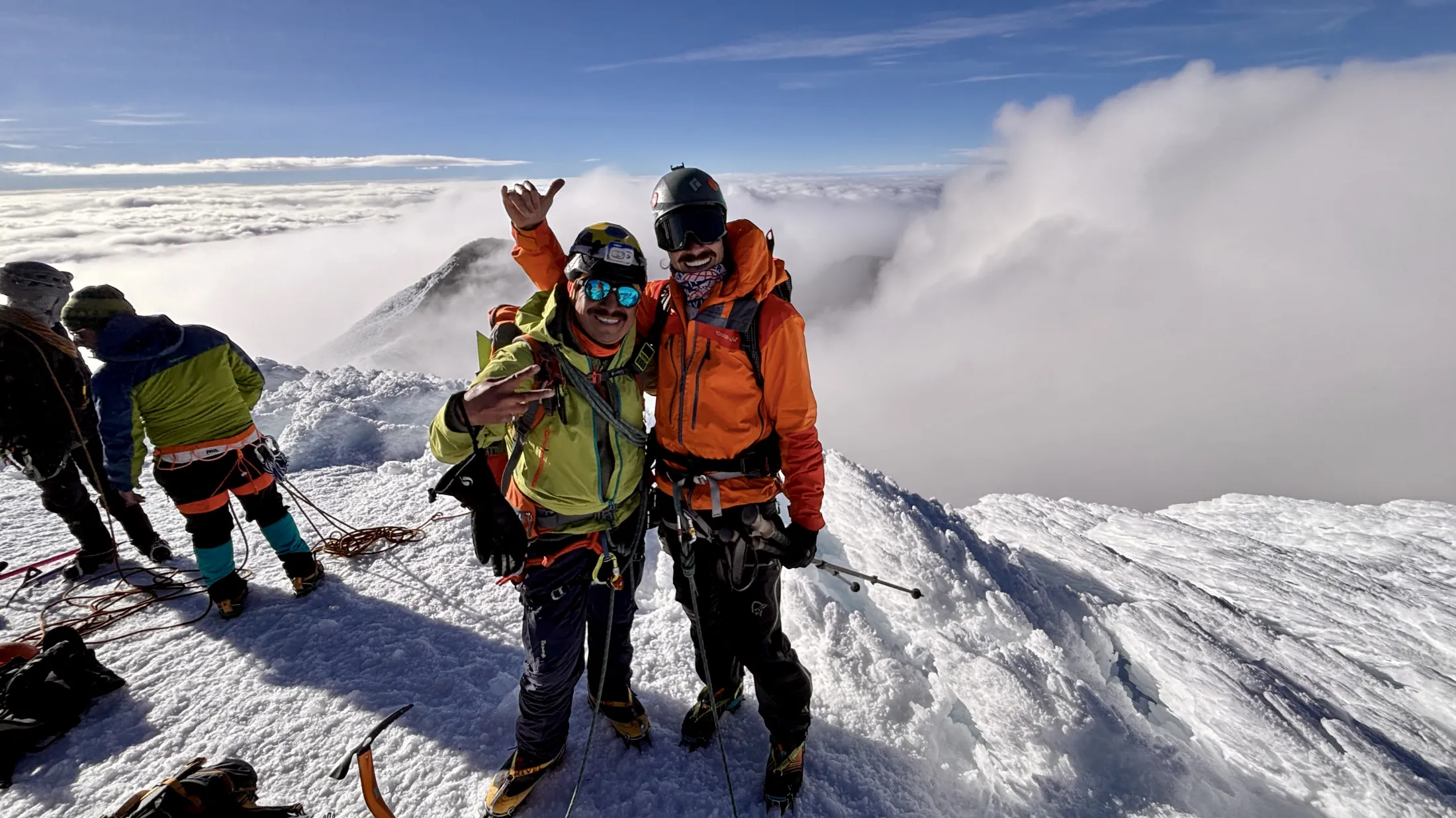 Two climbers at summit of volcano 