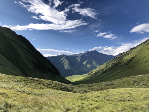 Mountains and meadows and blue skies