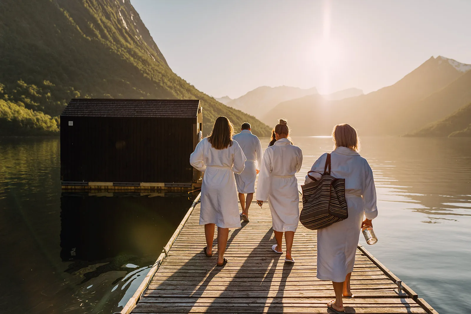 People walking towards a sauna.