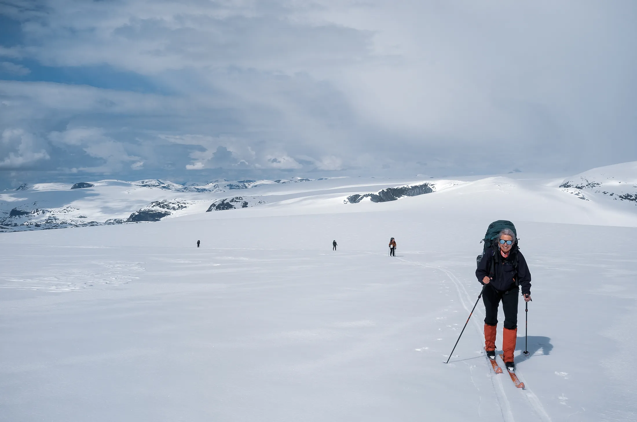 Skiers crossing Jostedalen Glacier in sunny weather