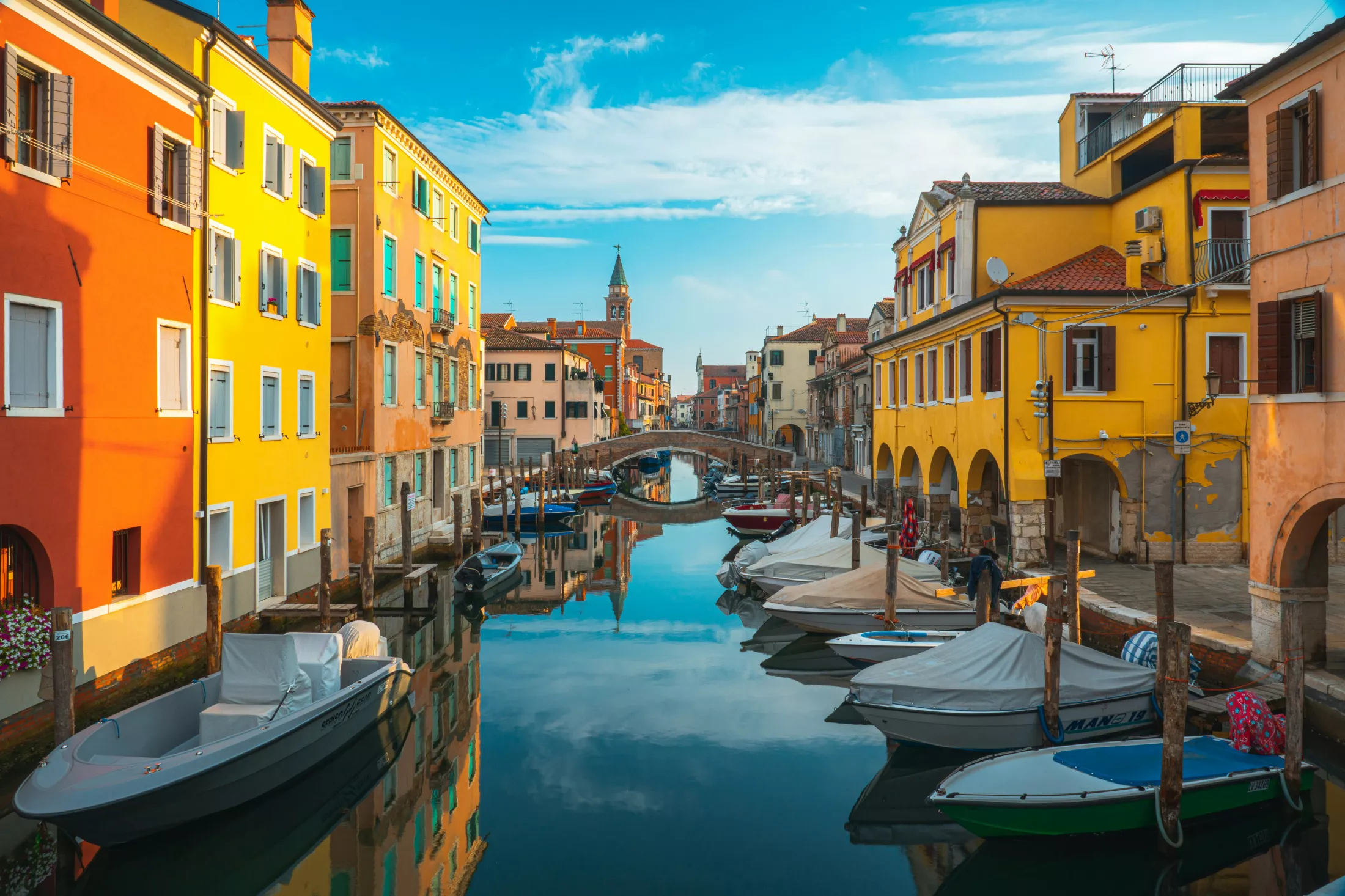 Canal, boats and houses.