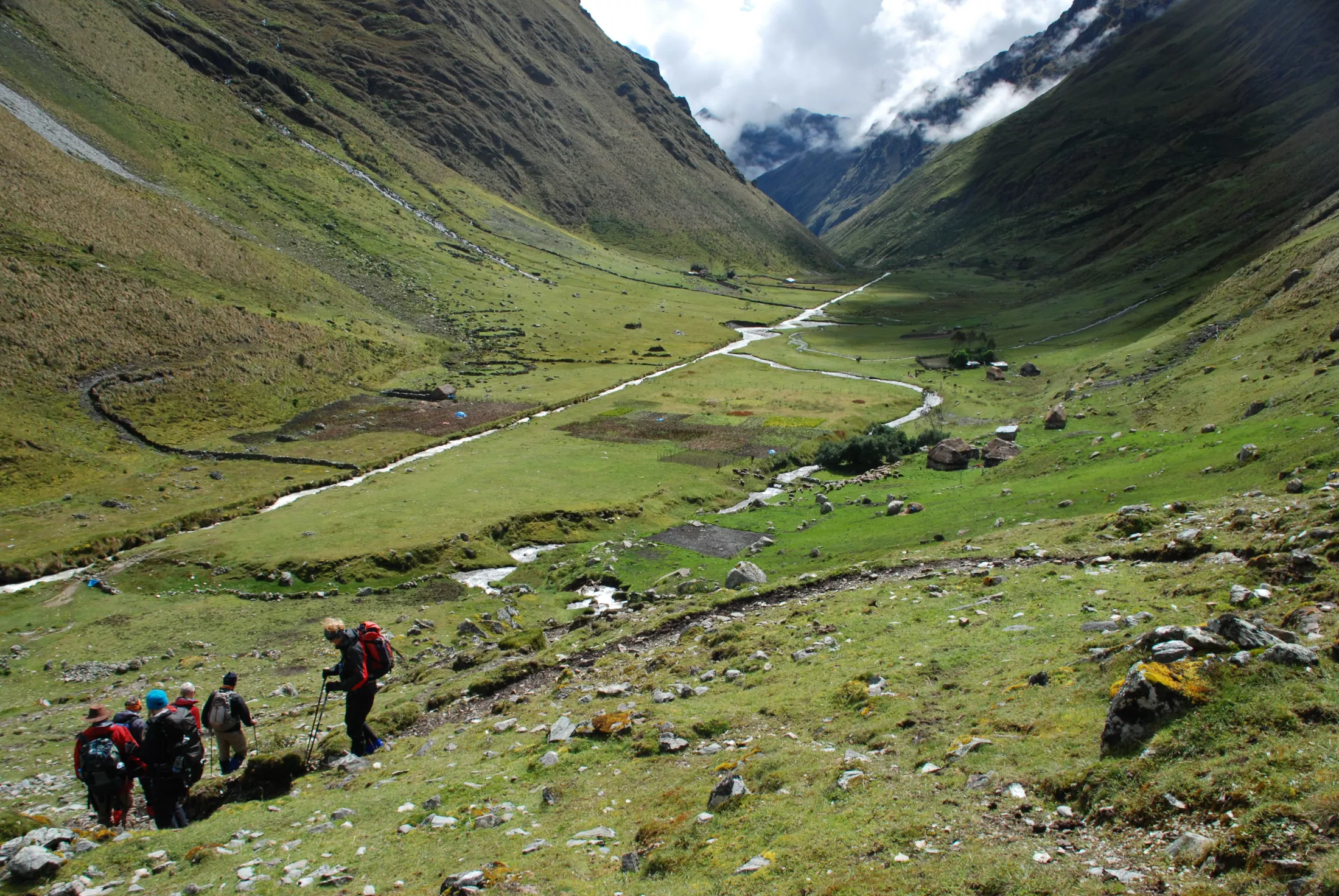 People walking on a trail in a valley