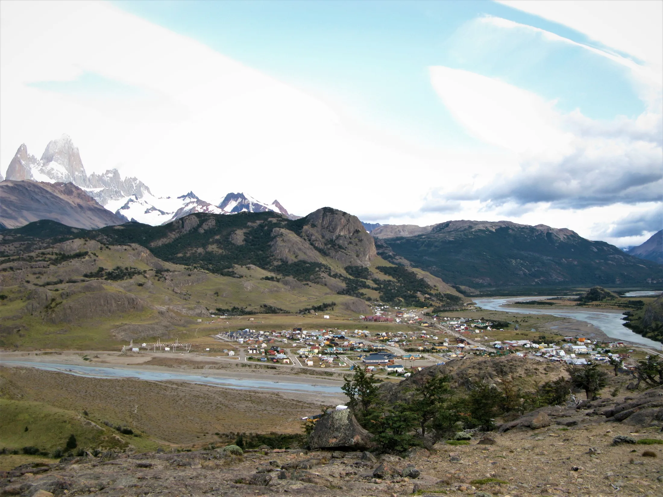 An overview shot of El Calafate along the river, with the mountains in the distance