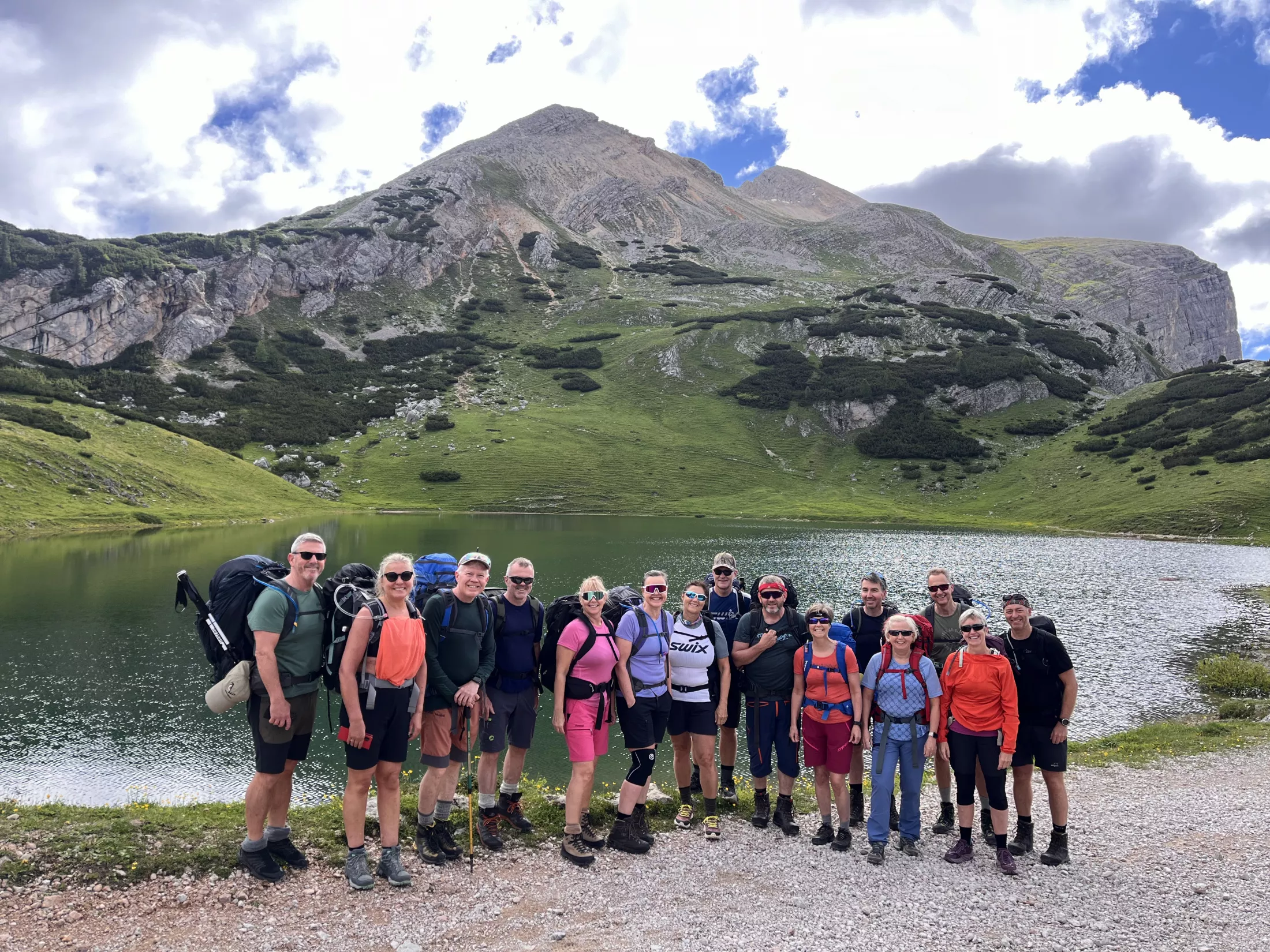 People by lake in mountains