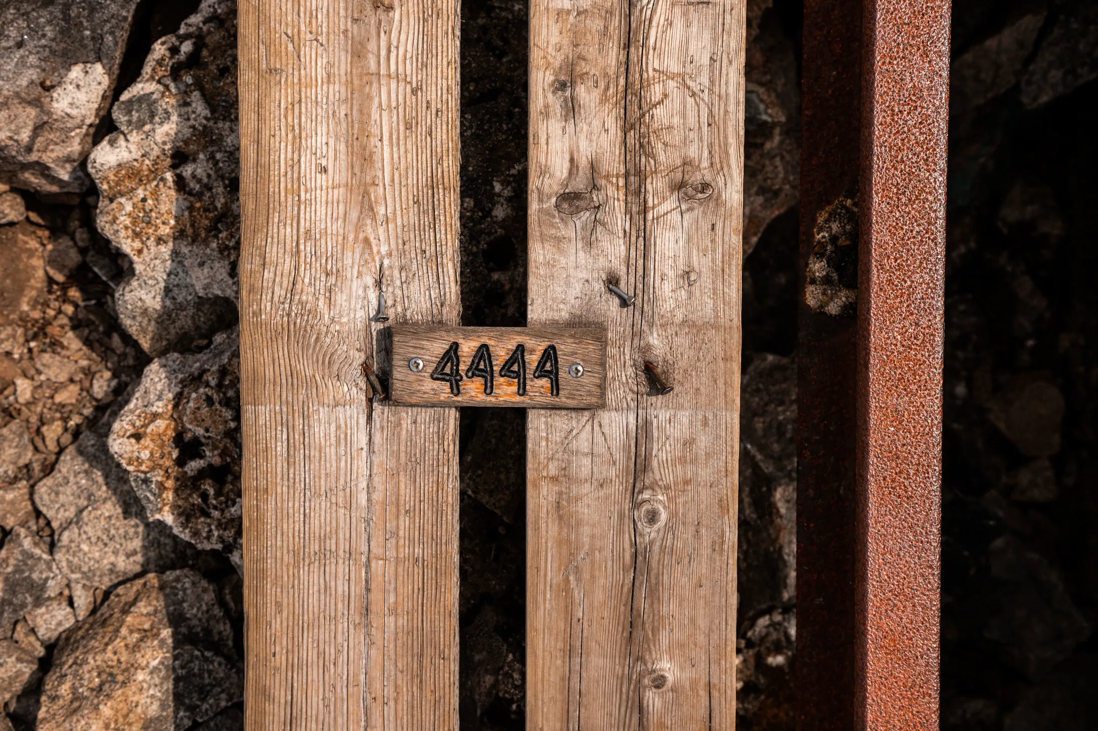 A wooden sign with four digits.