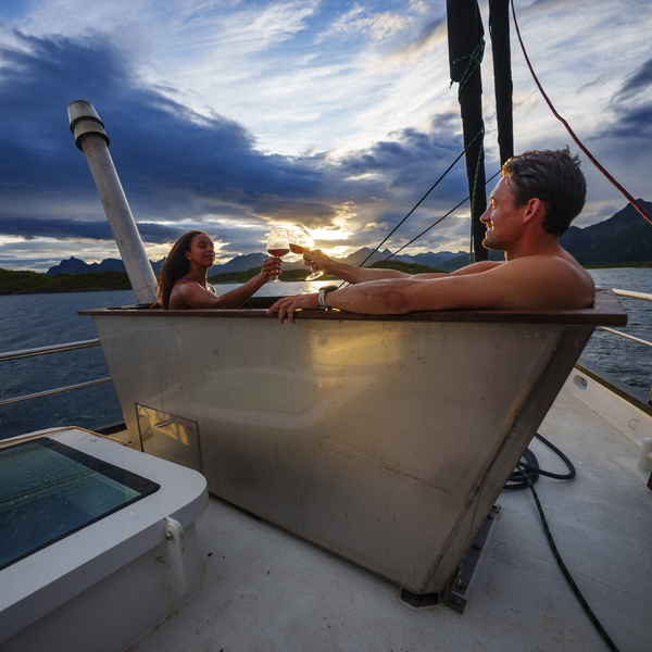 Two people in a hot tub on a sail boat