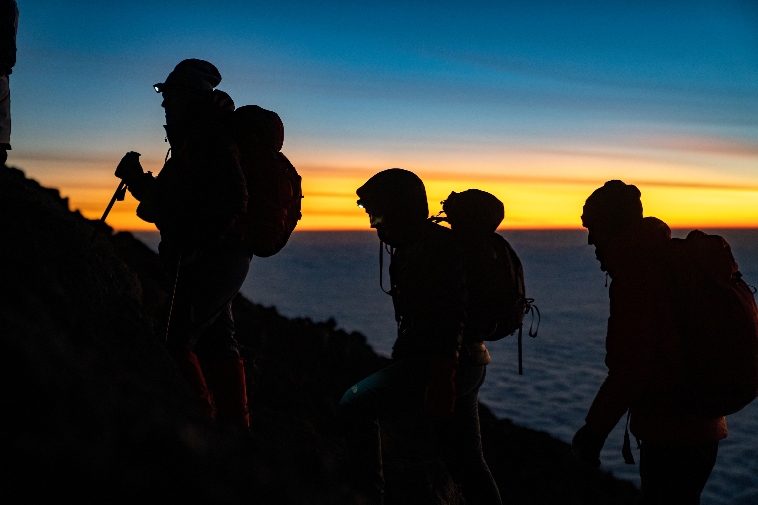 People in sunrise in mountain