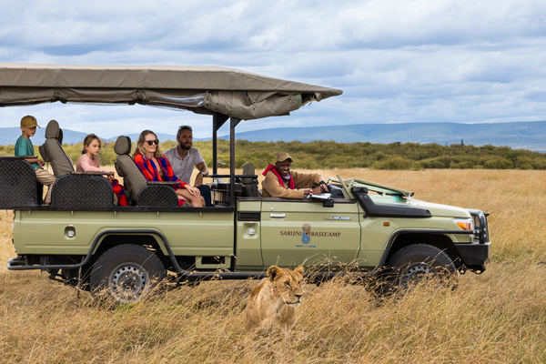 Group of people on jeep in the savannah on safari