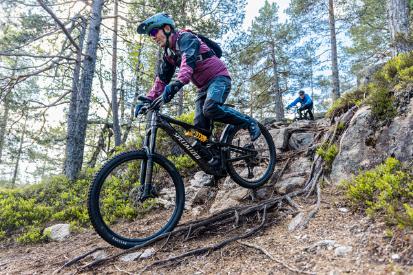 A man biking in the forest