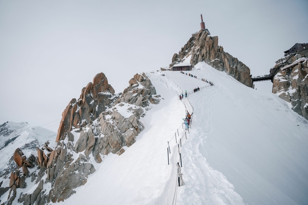 People walking down a ridgeline