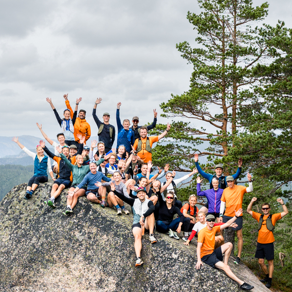 A group of people on a rock in the forest