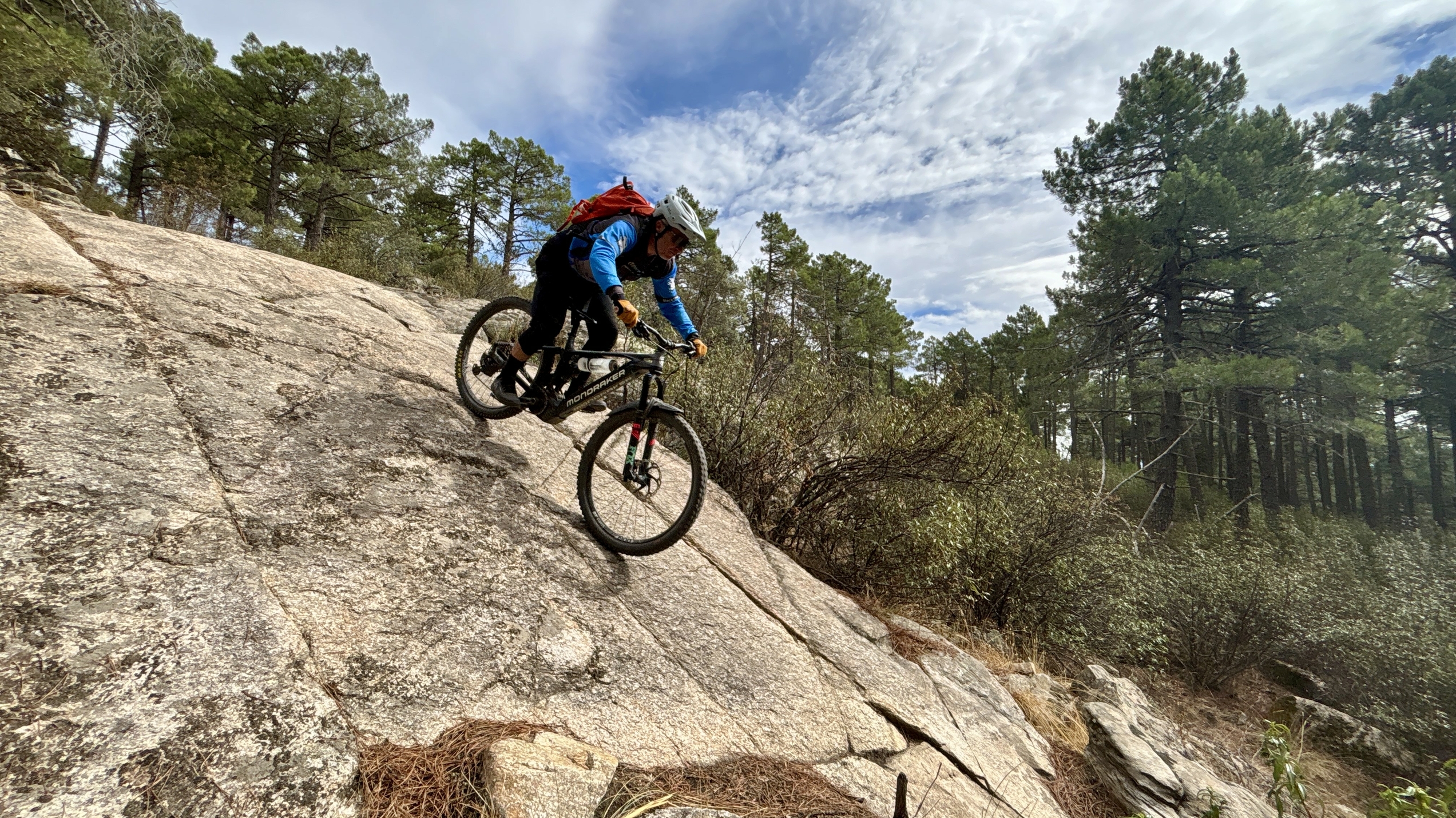 Mountain biker riding down slab rock