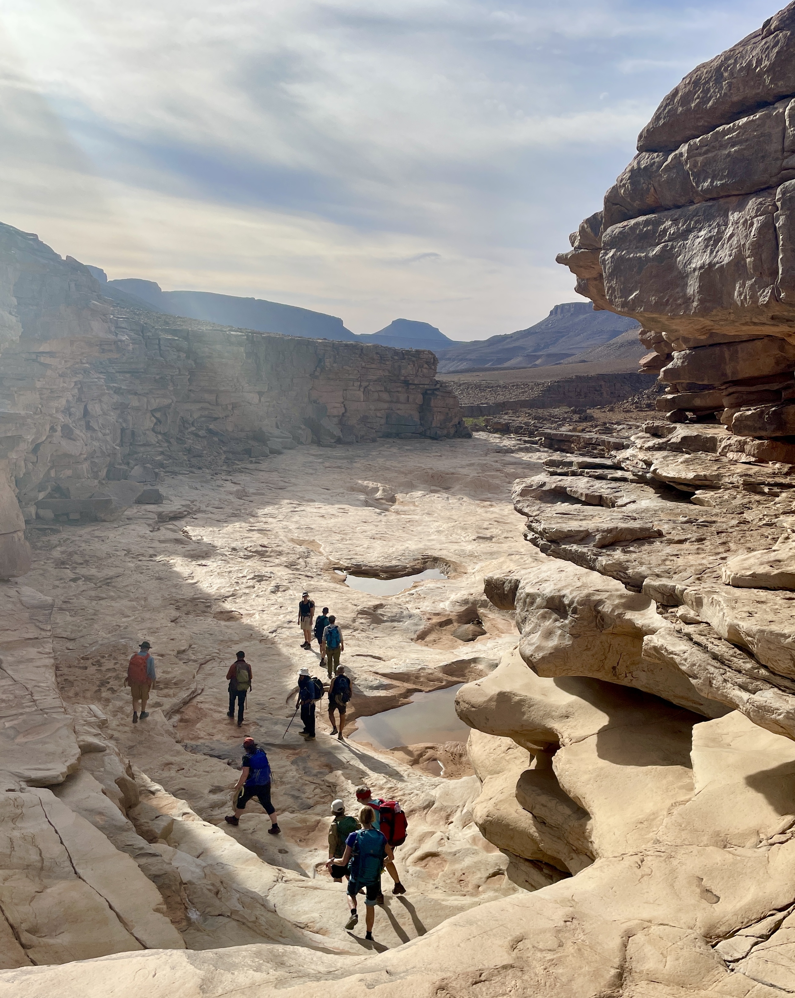 Dried up riverbed with people