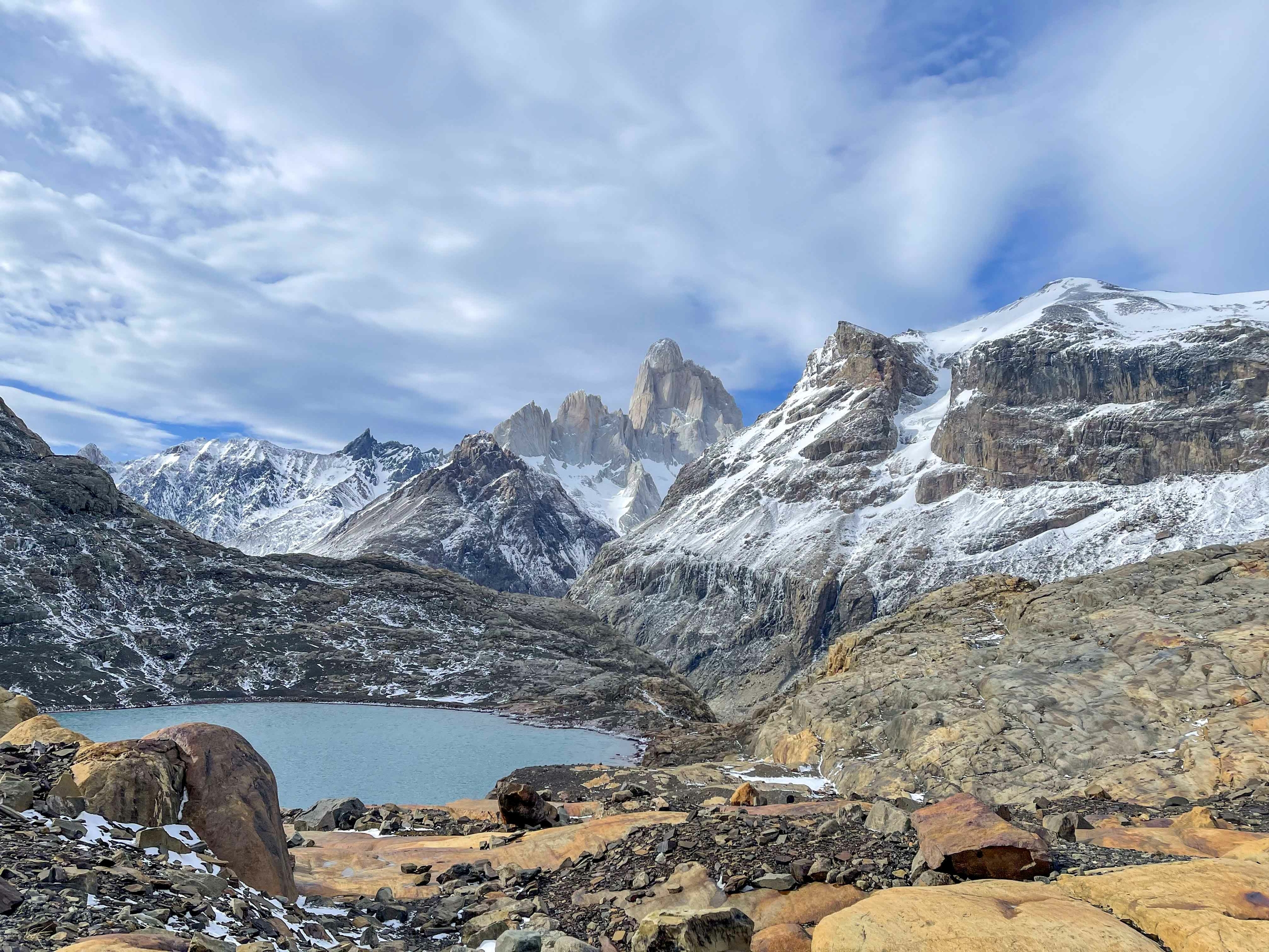 Snow covered mountains in Patagonia with a lake in the front
