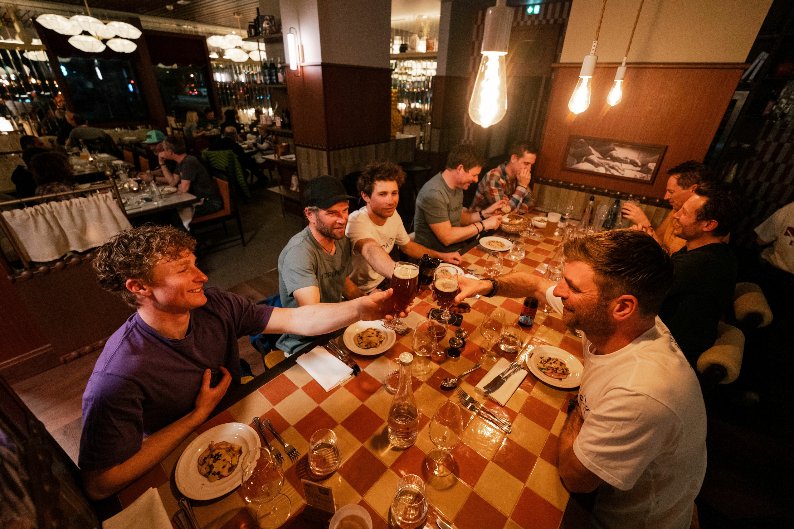 Group of people sitting around a table eating