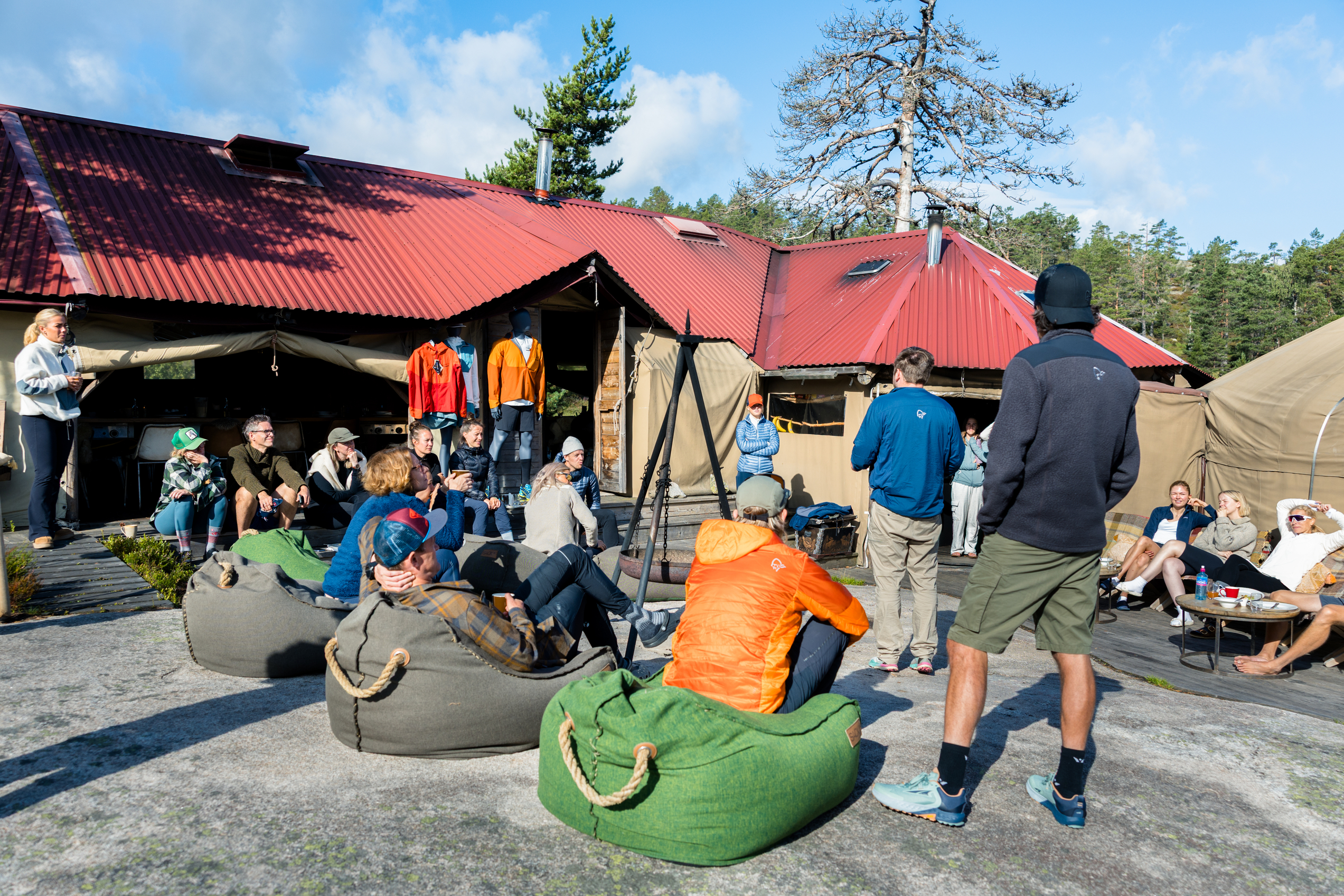 People on bean bags in a camp in the forest