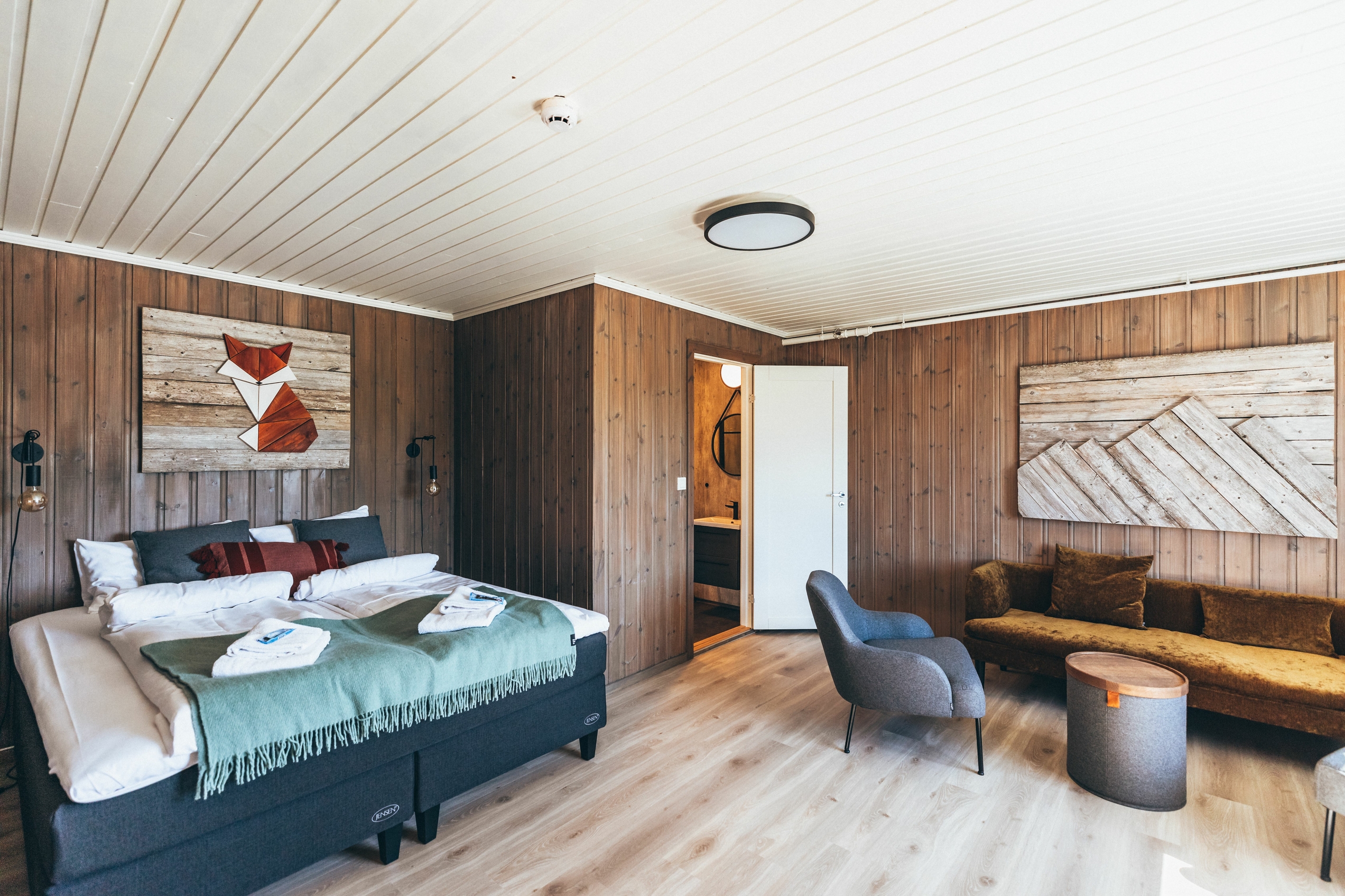 A cozy hotel room with wooden interior