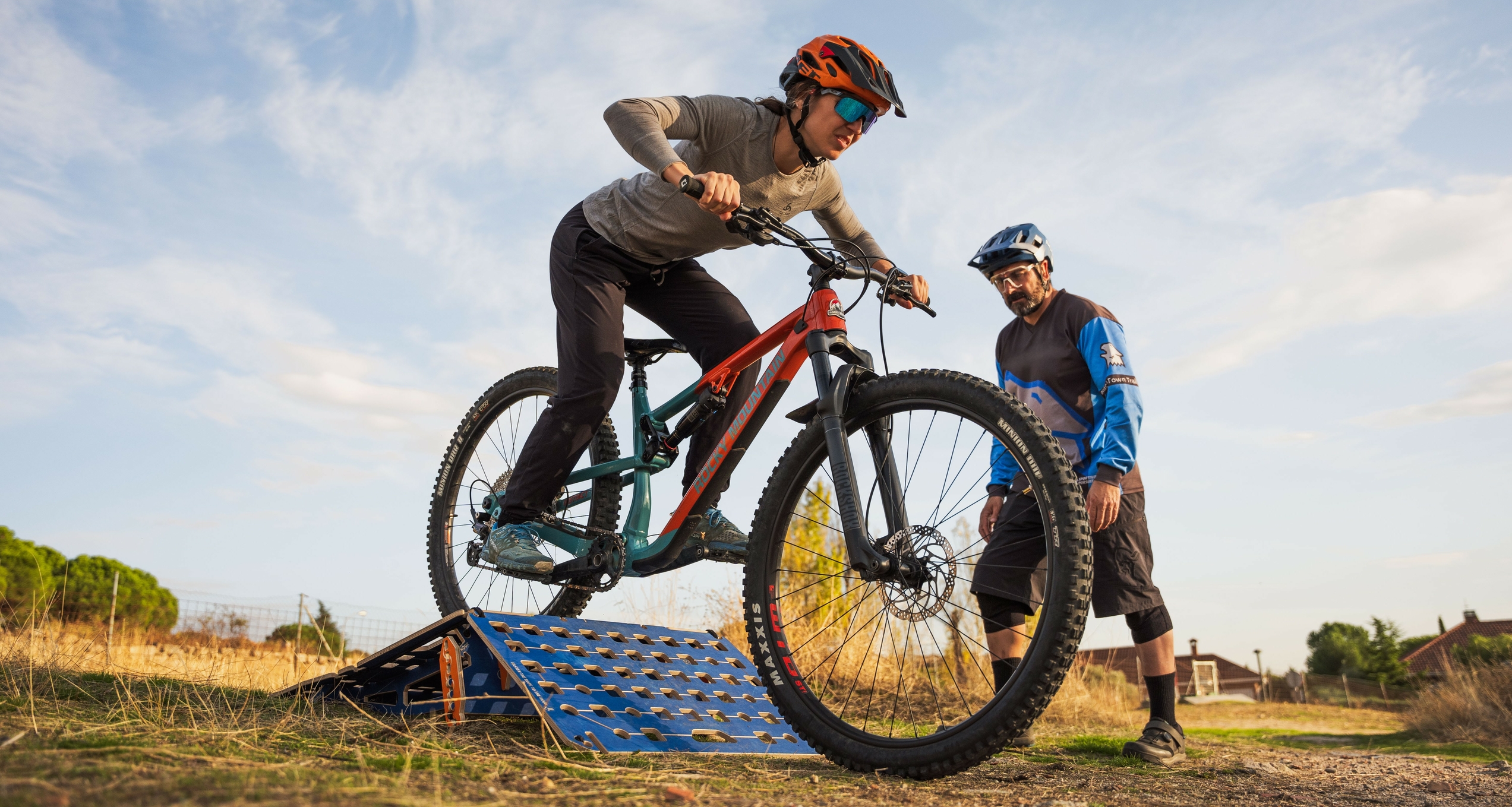 Mountain biker riding over roller 